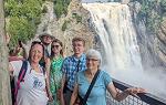 Group photo with Montmorency Falls behind 