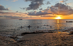Students swimming at sunset in St. Croix